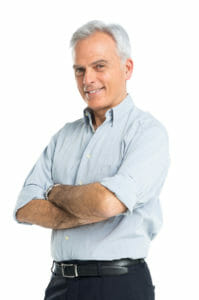 Happy Mature Man With Hands Folded after Hair Loss Treatment